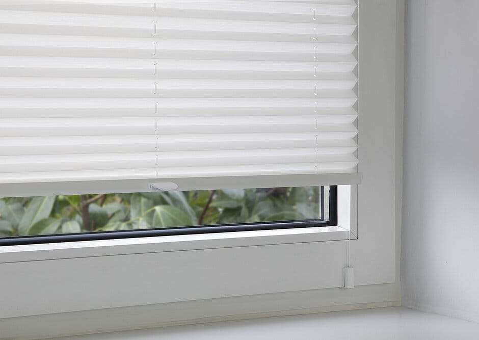 Pleated blinds on the window frame